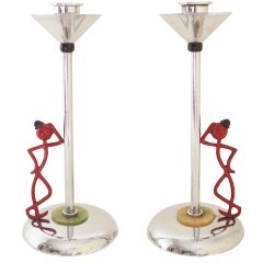 Pair of English Art Deco Chrome Plated "Leaning on the Lamp-Post" Candlesticks