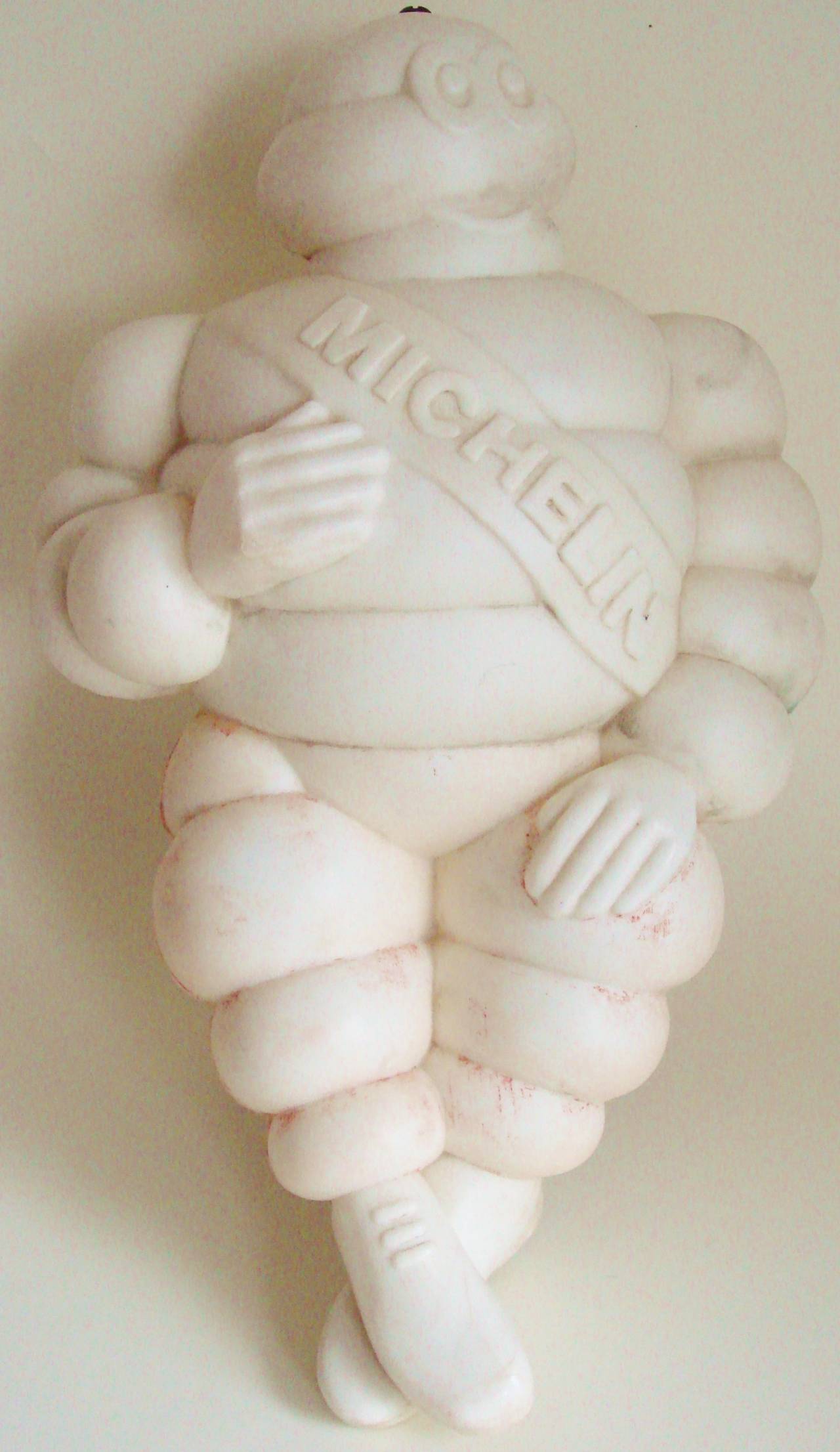 This large French Bibendum truck cab mascot dates from the 1960s and was actually made in Finland for the French tire company, Michelin et Cie in 1966.These mascots were made from hard plastic and mounted, by means of an aluminium plate and