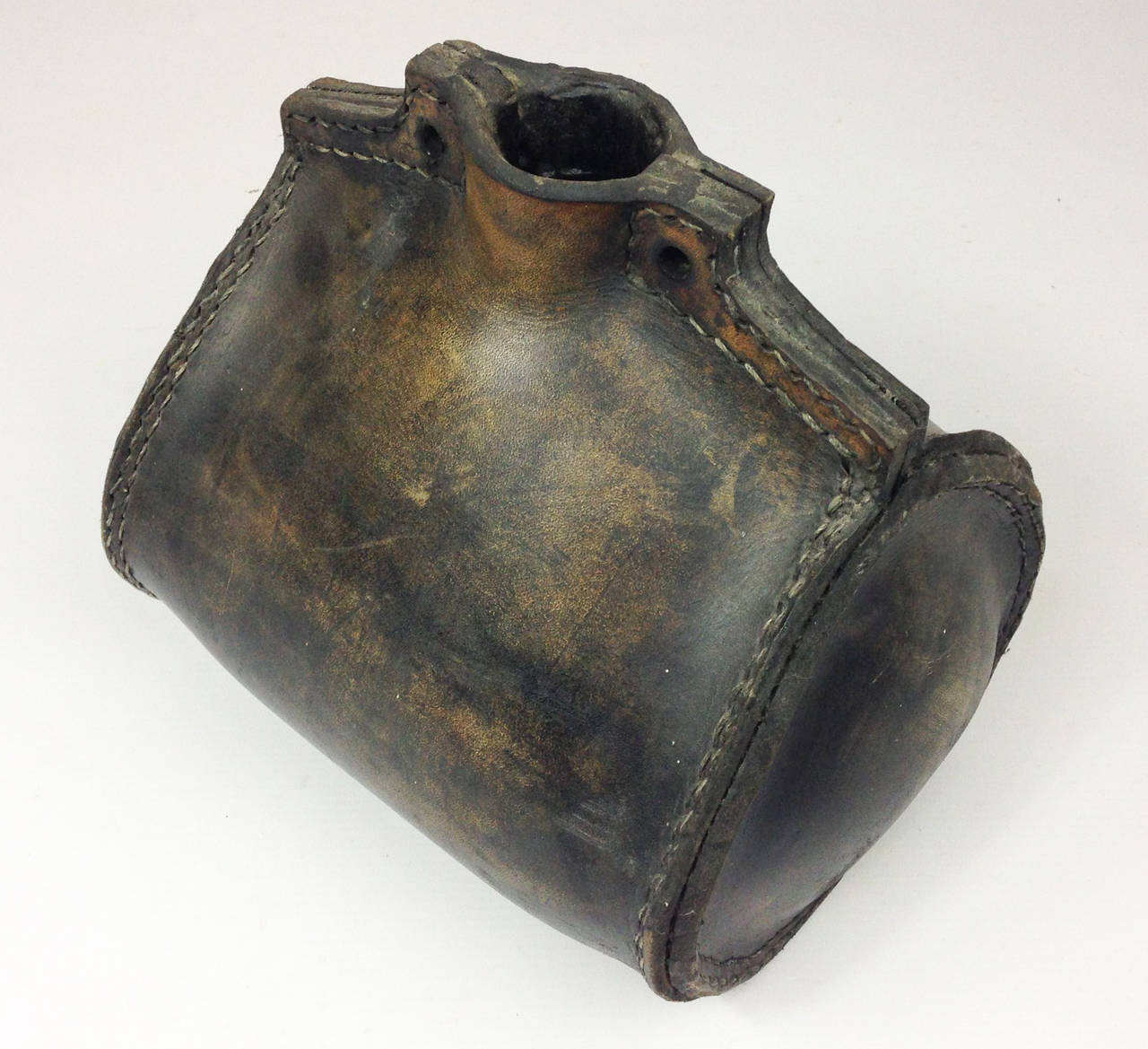 A 19th century English powder or water flask. Constructed of tarred leather with strong stitched seams. 

Ex-museum exhibit.
