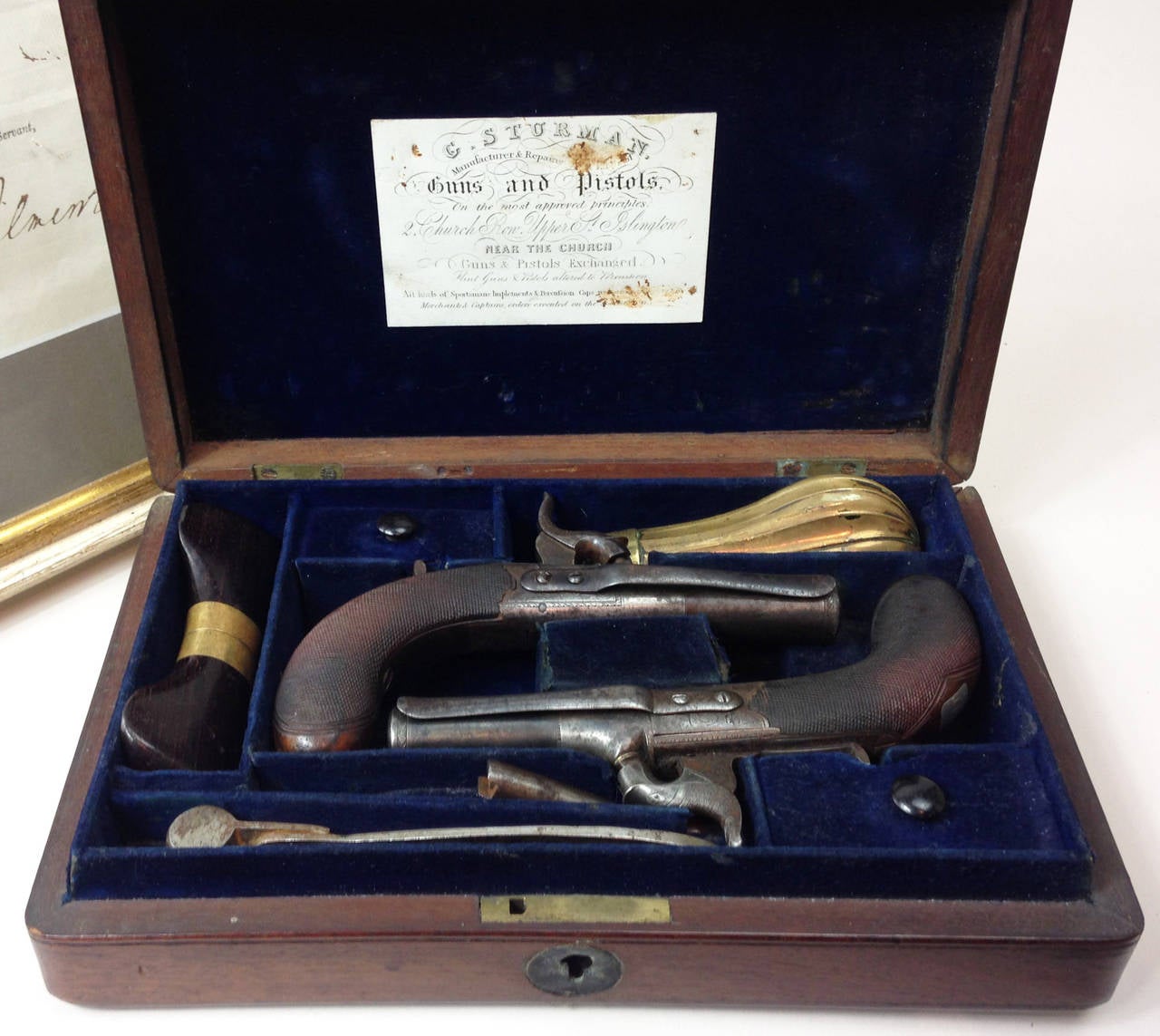 A scarce pair of Williams percussion belt pistols.

Set in a velvet-lined mahogany case with compartments for the pistols, as well as screwdrivers, powder flask, bullet mould etc. To the inner lid is the original trade label of G Sturman, 2 Church