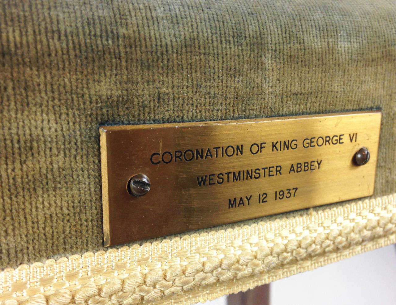 An original and unrestored example of an oak Coronation stool made for and used at the Coronation of George VI at Westminster Abbey in 1937.

The stool still has its original green upholstered top - albeit faded with some light staining. The lace
