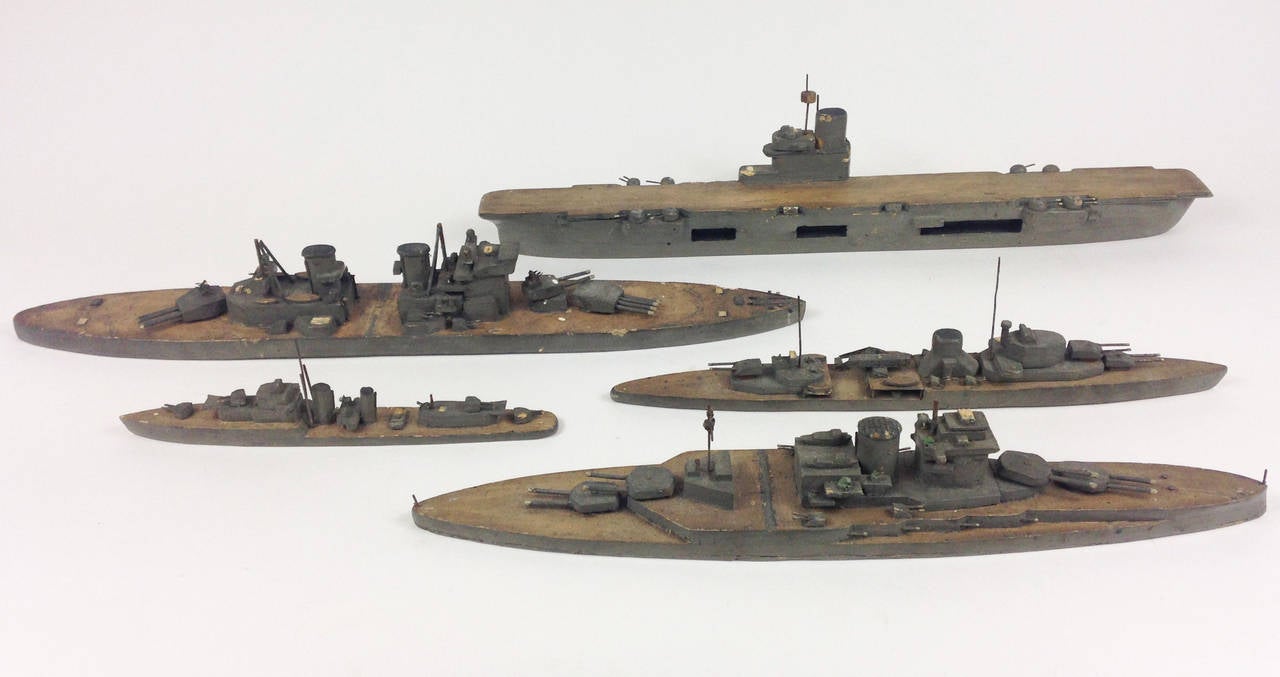 A very rare group of five wooden Royal Navy vessels.

The models have been built with precise detail using metal wire for gun barrels, aerials etc although they are predominantly wooden. It is believed that these were used on plotting maps to