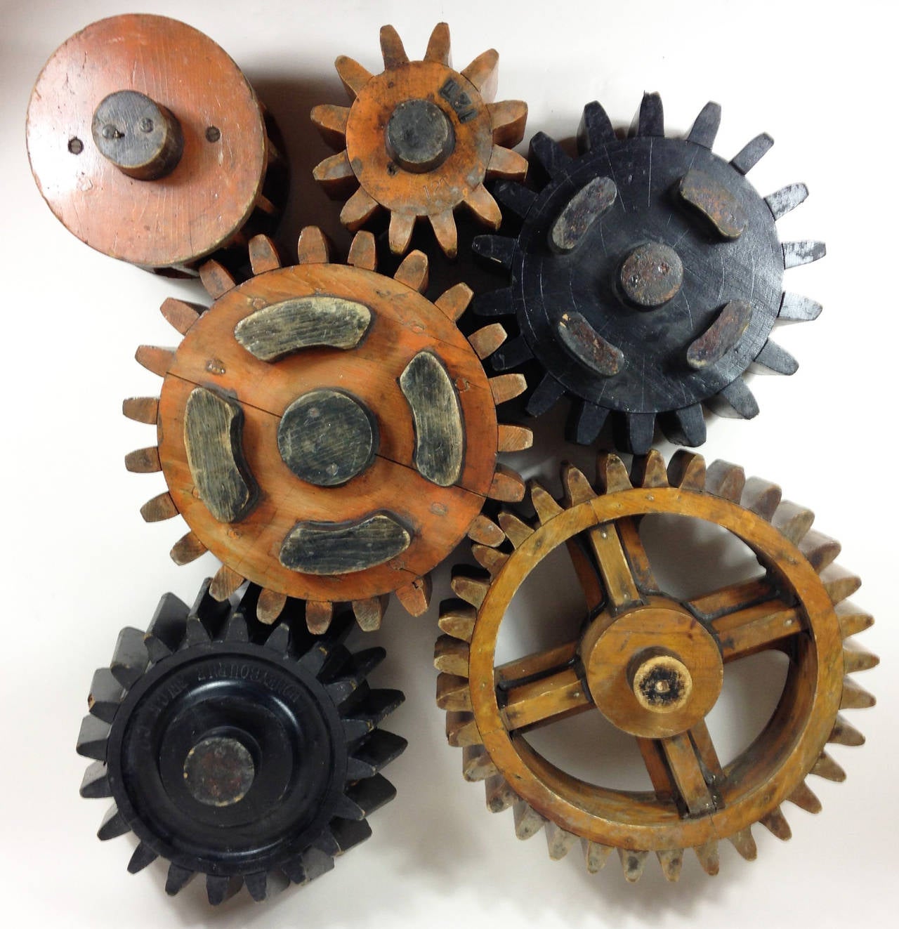 Painted Group of Six English Wooden Cog Moulds For Sale