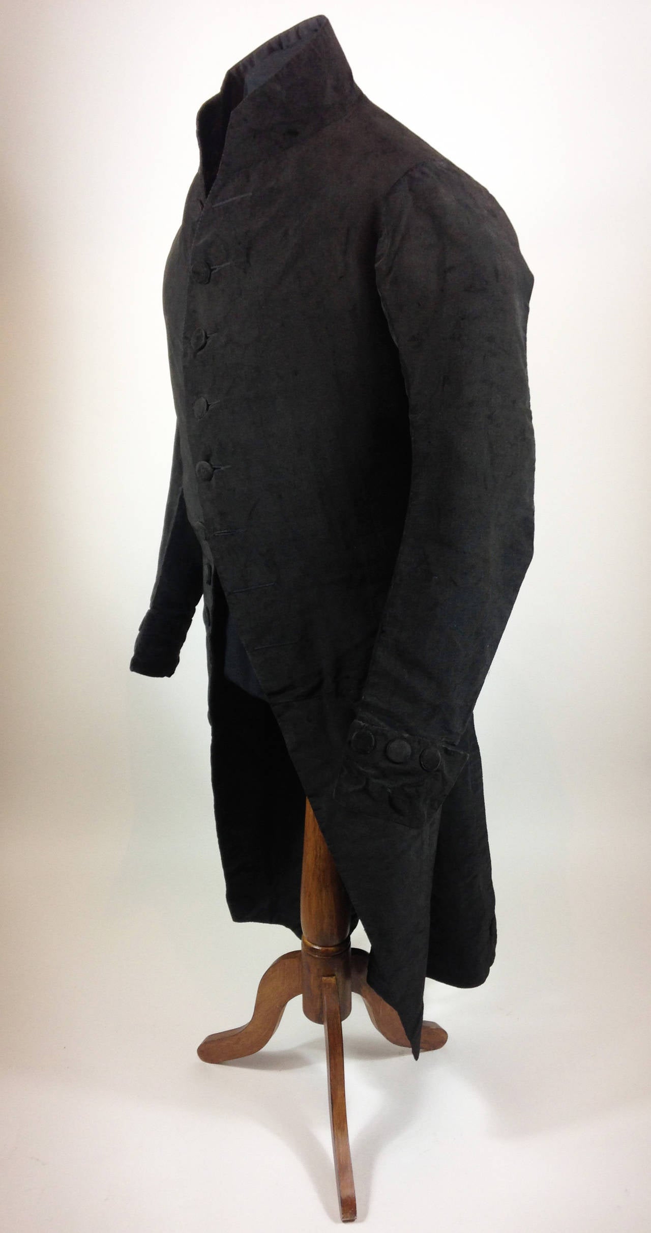 A very rare and unusually large example of a gentleman’s frock coat of bombazine circa 1790.

Wonderful condition for its age - there is some evidence of moth, however this does not detract. The material still has a wonderful shine and all buttons