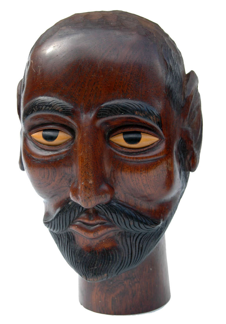 Indonesian Fine Pair of Carved Teak Gentlemen with Ebonised Features For Sale