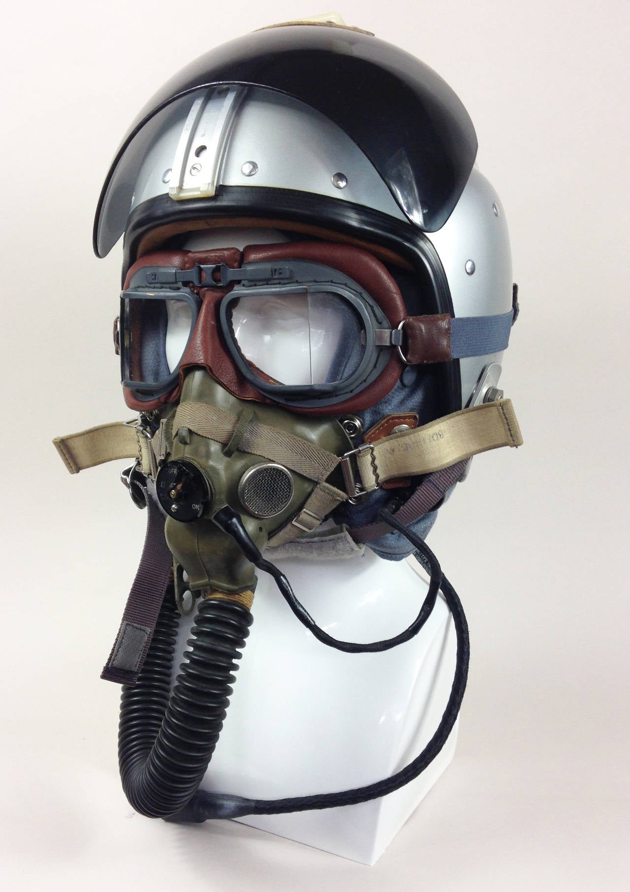 An extremely scarce, museum quality group of Royal Air Force pilot's headgear. 

Originating from the early years of the 'Jet Age' sets like this would have been worn in such iconic aircraft as the English Electric Lightning.

Consisting of a