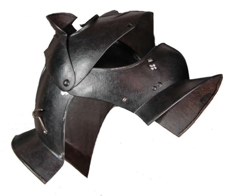 A very finely made helmet in a 17th Century Italian 'Savoyard' style.

With centre comb and hinged plates to allow the helmet to be opened.

A very fine example weighing in excess of 3Kg.
