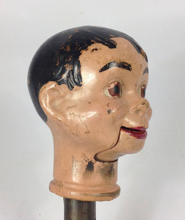 A scarce and rather spooky ventriloquist dummy head. The head has the original control pole and string to operate the mouth. 

Manufactured by the Reliable Doll Company of Canada, circa 1930. Some age related wear to the paintwork but otherwise in