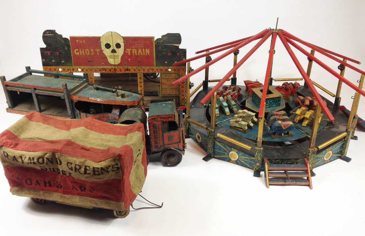 A truly wonderful item. A scratch built travelling fairground attraction dating from the early to mid 1930's. 

Consisting of a large carousel with carved wooden ride-on animals of all shapes and colours.  A ghost train with a small metal train