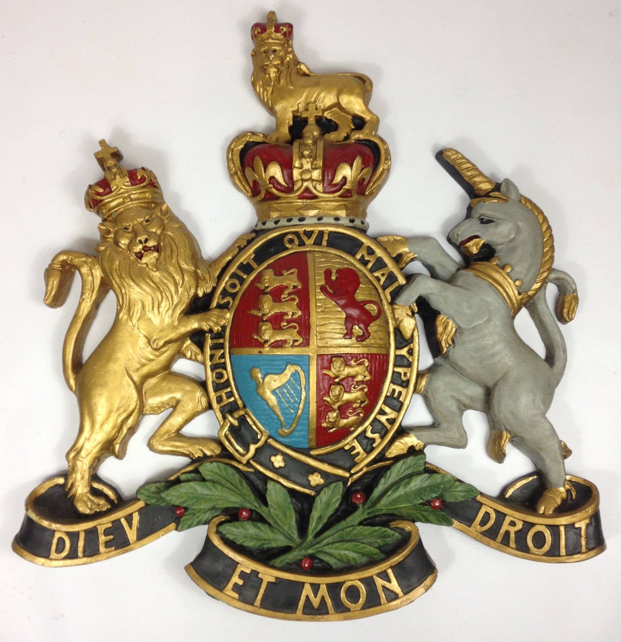 A large and imposing Queen Elizabeth II era Royal coat of arms.

Constructed of hand painted fibreglass in the traditional form with lion and unicorn either side of the union standard, all surmounted by the Queen's crown. Including the Latin