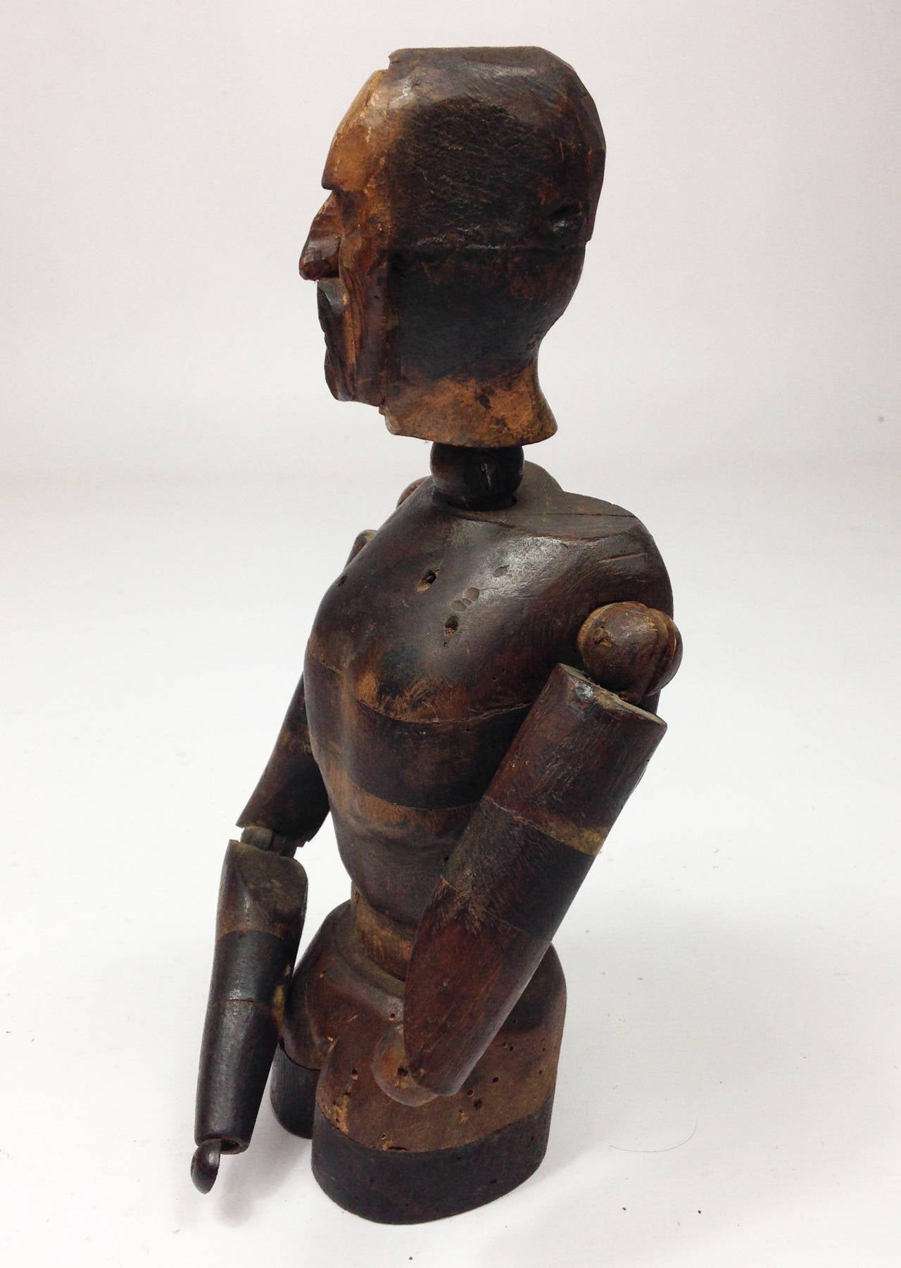 An unusual mid 19th century wooden lay figure.

Constructed of several sections, articulated joints and various types of wood.

Carved male head in a medieval style.