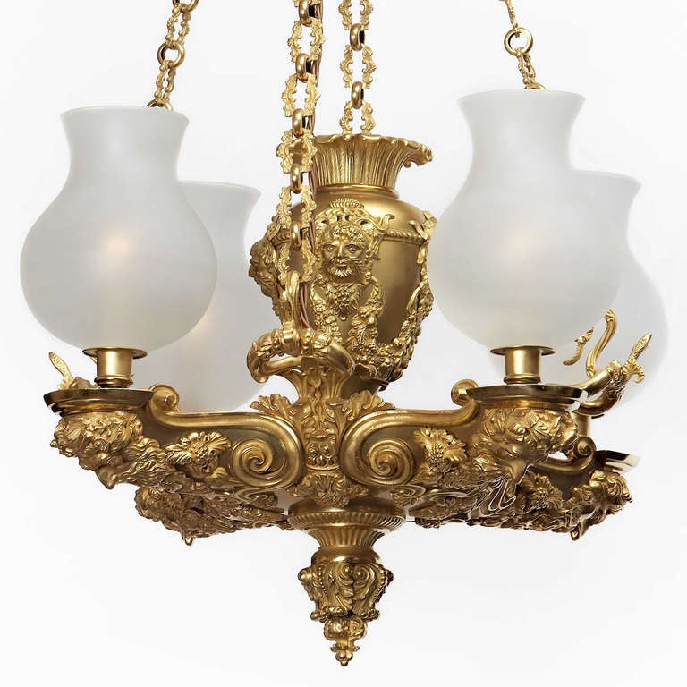 A splendid four-light gilt bronze Chandelier by Hancock and Rixon with its original colza oil urn in the centre, circa 1826 electrified
Provenance: In the collection of Lord Coleridge, Fillongley Hall