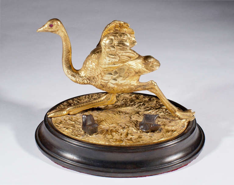 A rare Regency Ostrich Inkwell, the top part opens to reveal an ink pot, in front of the ostrich is a quill holder: English, circa 1820