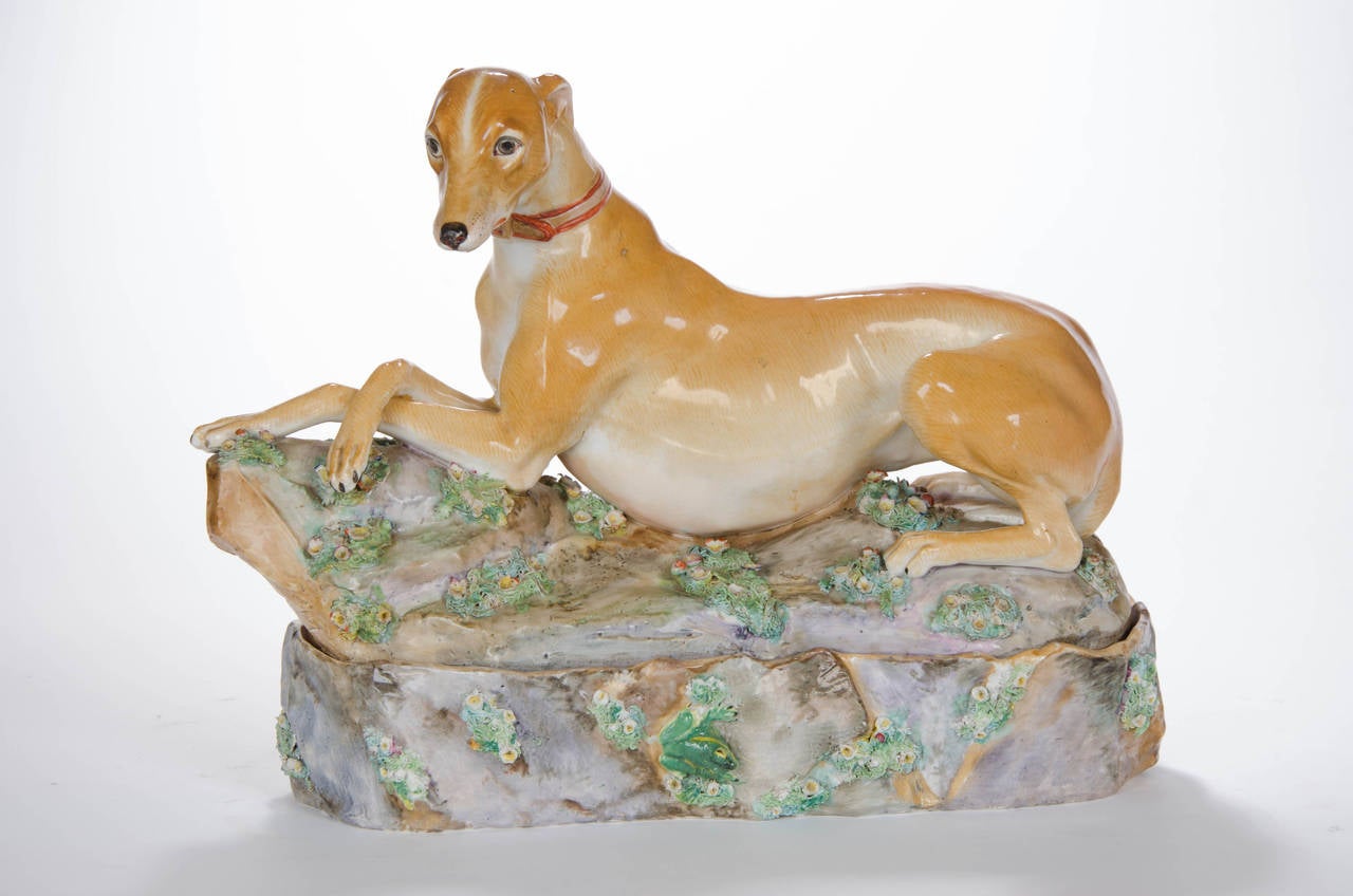 A porcelain figure of a recumbent Italian Greyhound, the favourite dog of Catherine the Great.