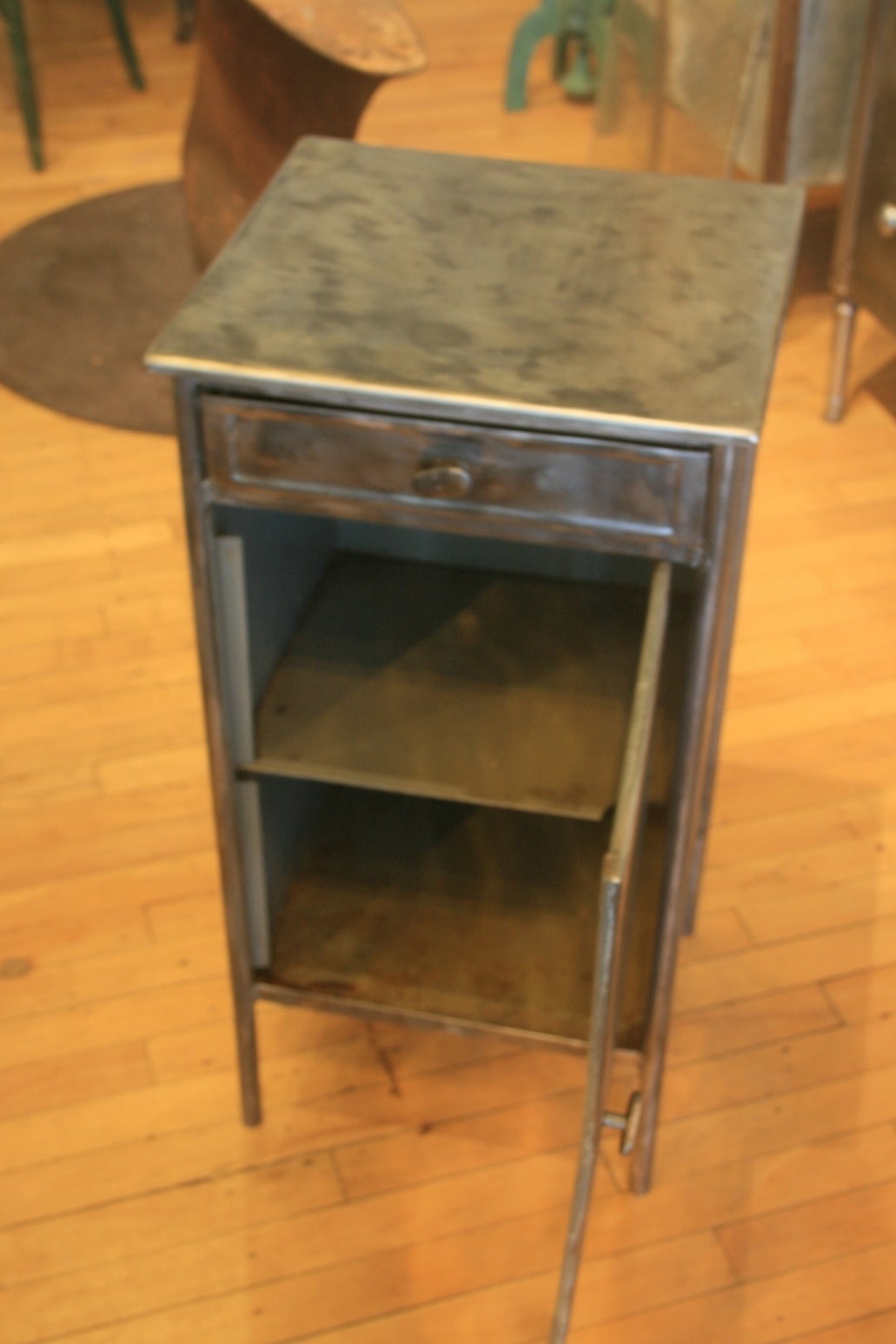 Great Looking Steel Nightstand cabinet.  There were several layers of gray paint on this piece. I had the paint stripped off and think it gives a nice industrial look.