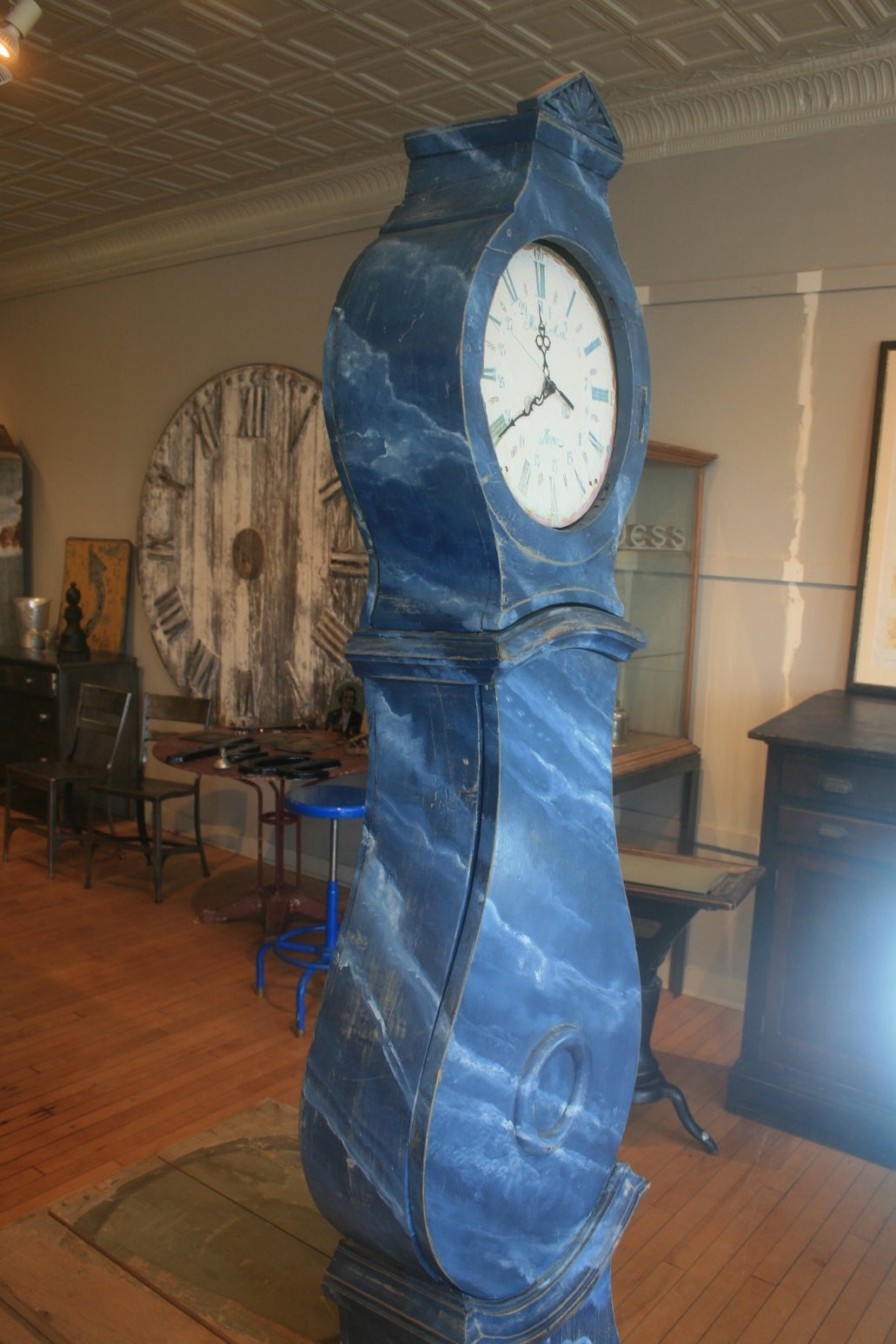 Great Swedish mora clock, circa 1810 with blue faux marble paint, makes it a very unusual interesting and beautiful piece. I always love the sculptural look of these handmade clocks and the paint is usually a big reason so many of them are beautiful