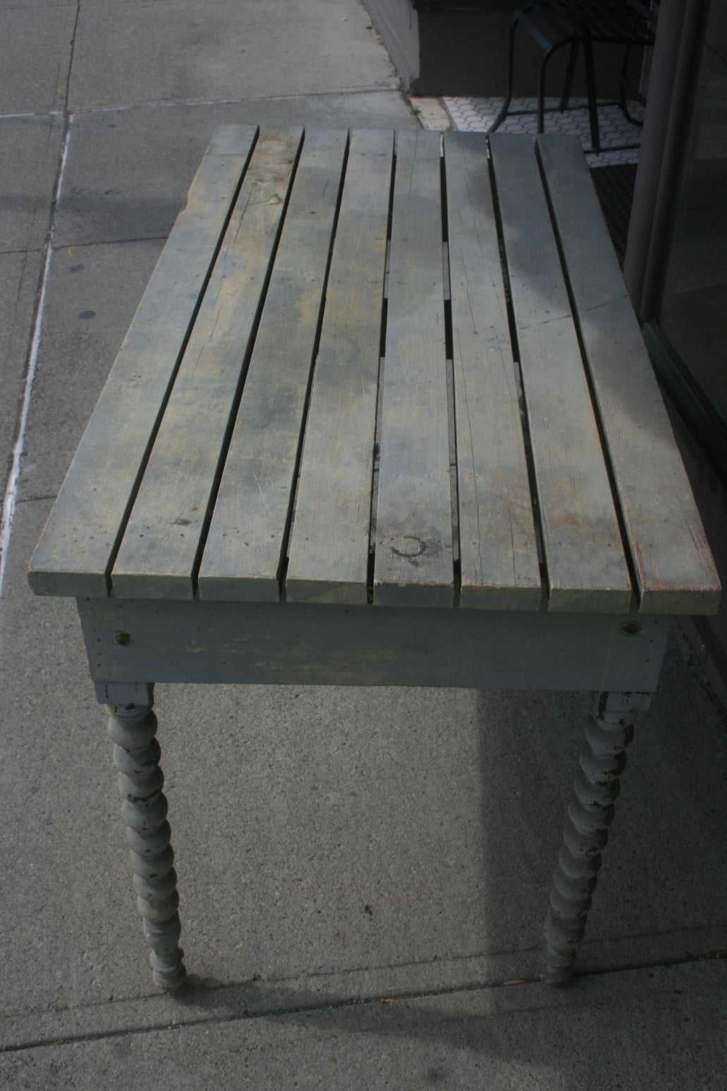 Great Looking Gray Table. The slatted top and Victorian turned legs make this piece unusually beautiful.