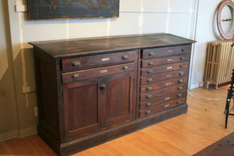 Surveyor's Bureau for maps, plus cabinet. Dated 1905 with the name of the surveyor inside.  This is a great looking piece of furniture with lots of atmosphrere.  There are 10 drawers and a cabinet section. The drawers measure 26
