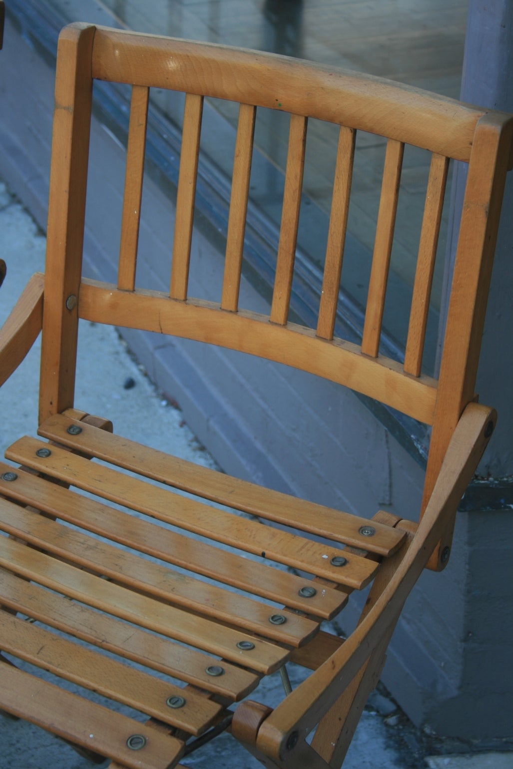 Beautifully designed Pair of Italian Folding  Deck Chairs with Arms. These chairs fold into a small square as pictured. They are made of hardwood and have all brass fittings. Made by Brevetti Reguitti in Italy.