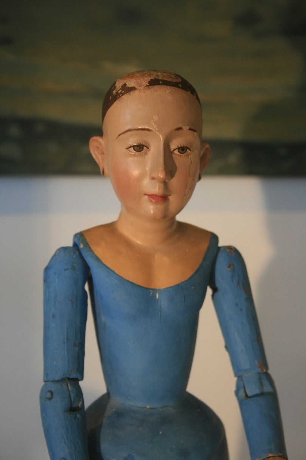 Beautiful 18th century Spanish Colonial Cage Doll Santos figure from Mexico.  She is probably St. Anna.  The cage has been wrapped in fabric and painted the traditional blue, the face has a serene expression.  The eyes are painted on which is a