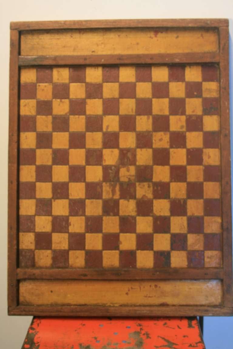 Early 20th or late 19th century Canadien game board. The paint is just great on this piece. It would make a nice addition to any collection.