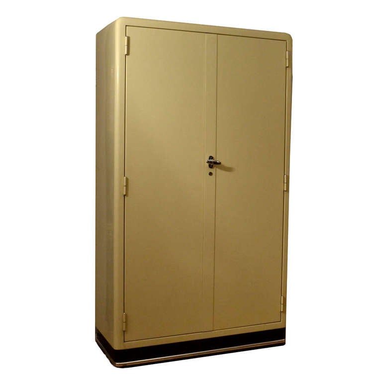 Art Deco Aerodynamic storage cabinet originally made to store medicine, is highly functional as a bathroom or kitchen cabinet. The doors can hold a huge number of small items like spices with easy overview. Inside there are original glass and metal