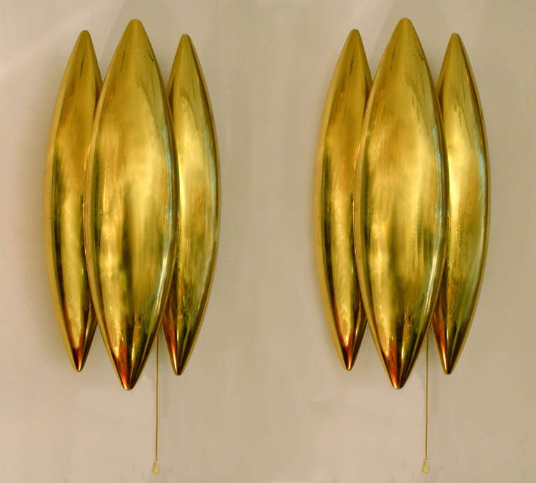 A pair of Kastor wall sconces in brass by Jo Hammerborg.