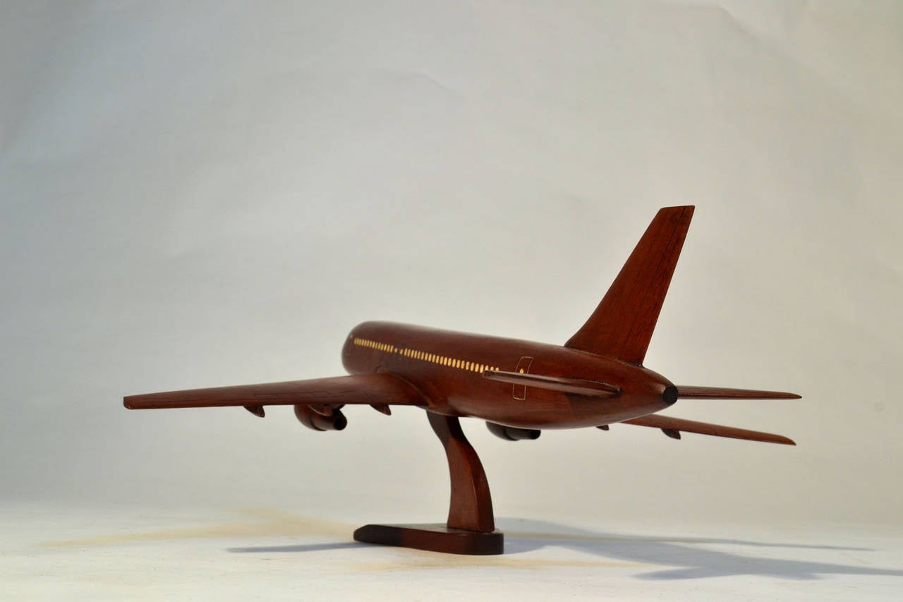Hand-carved model of a jumbo jet passenger's plane.