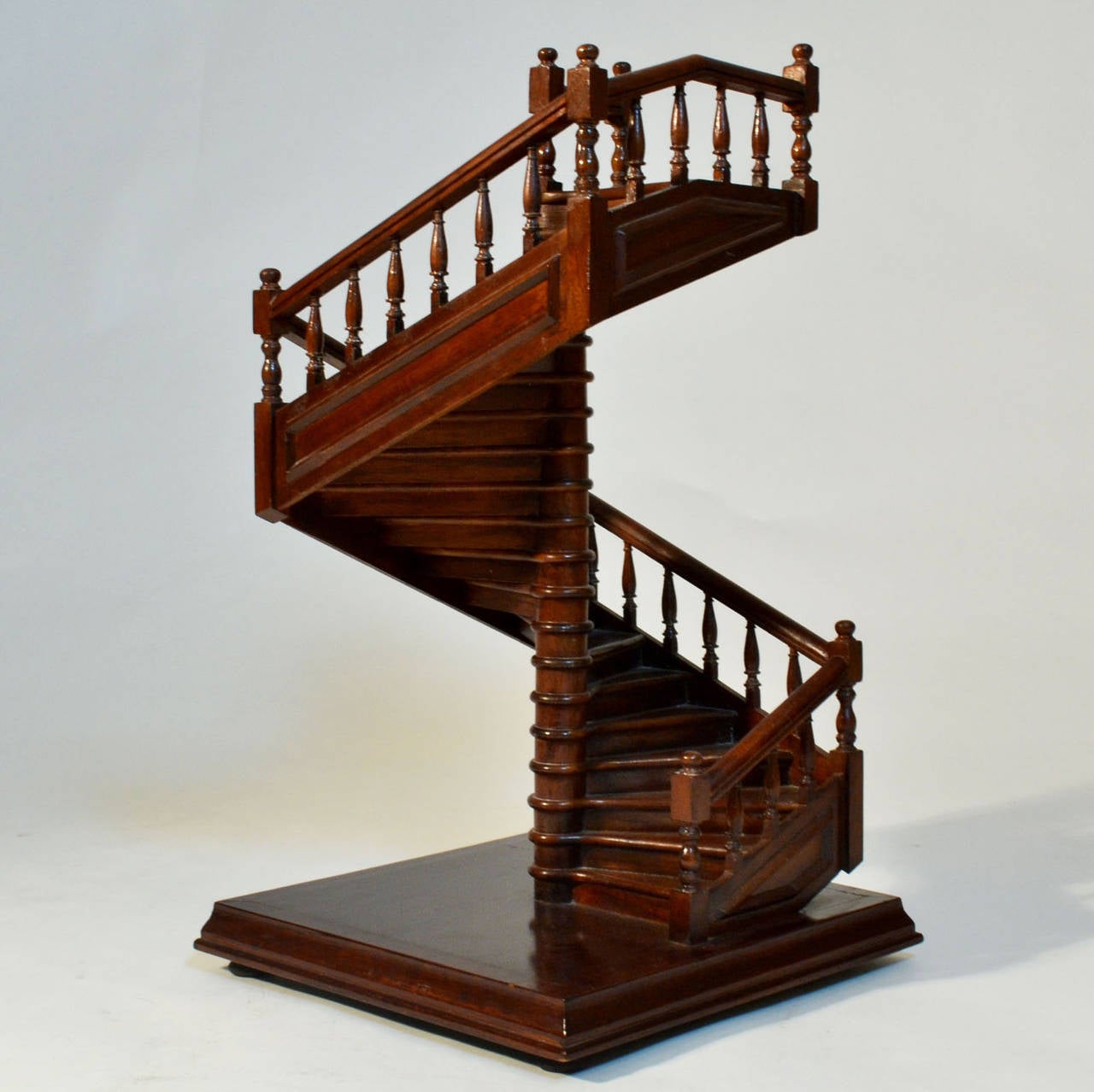 Late 19th century work of an apprentice after ten years of studies of cabinetmaking. The staircase is modelled in solid mahogany.