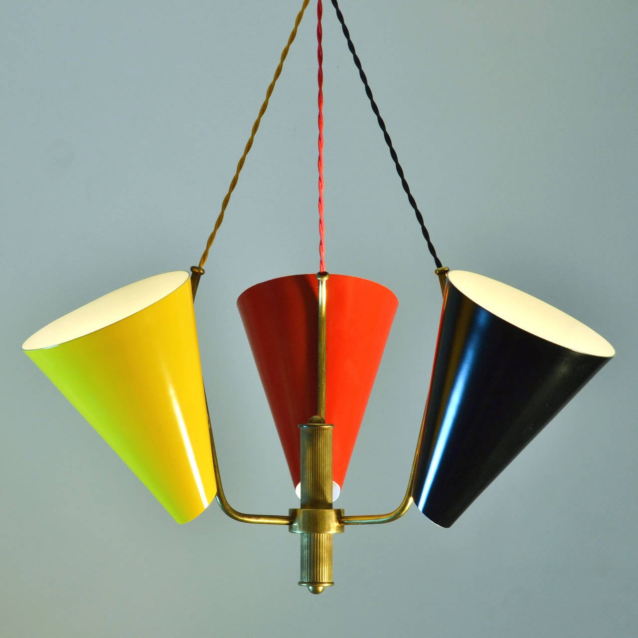 Three coned pendant lamp with adjustable brass fixtures.