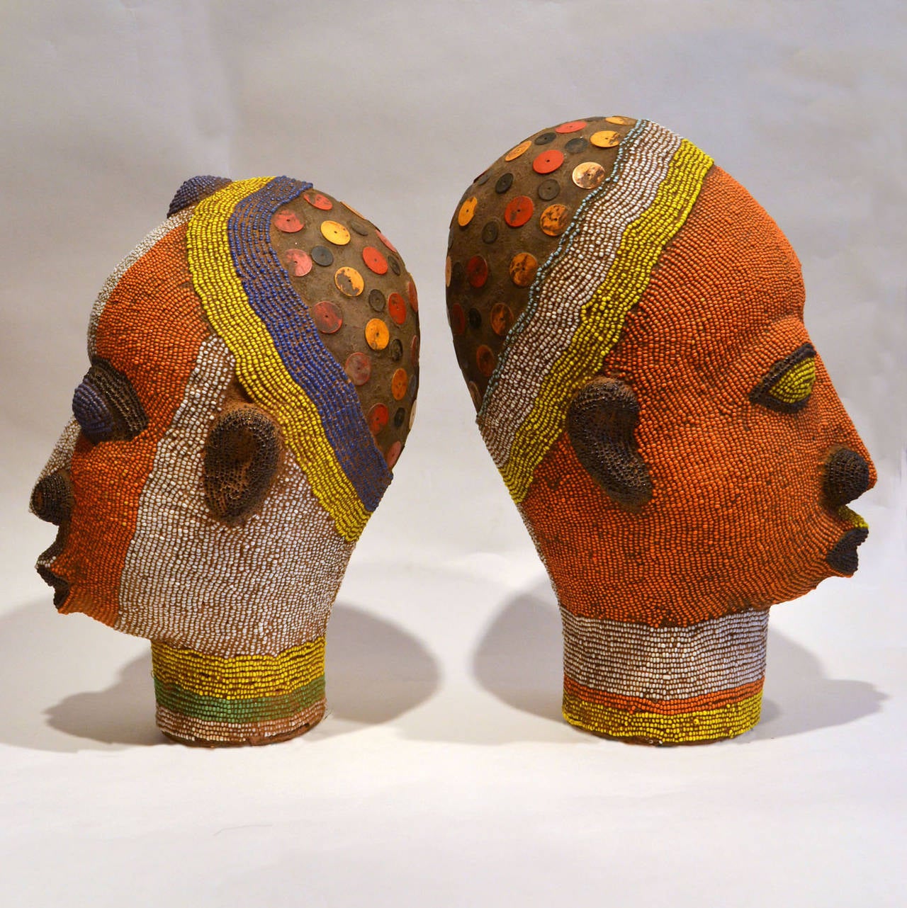 Nigerian Pair of Beaded Head Sculptures