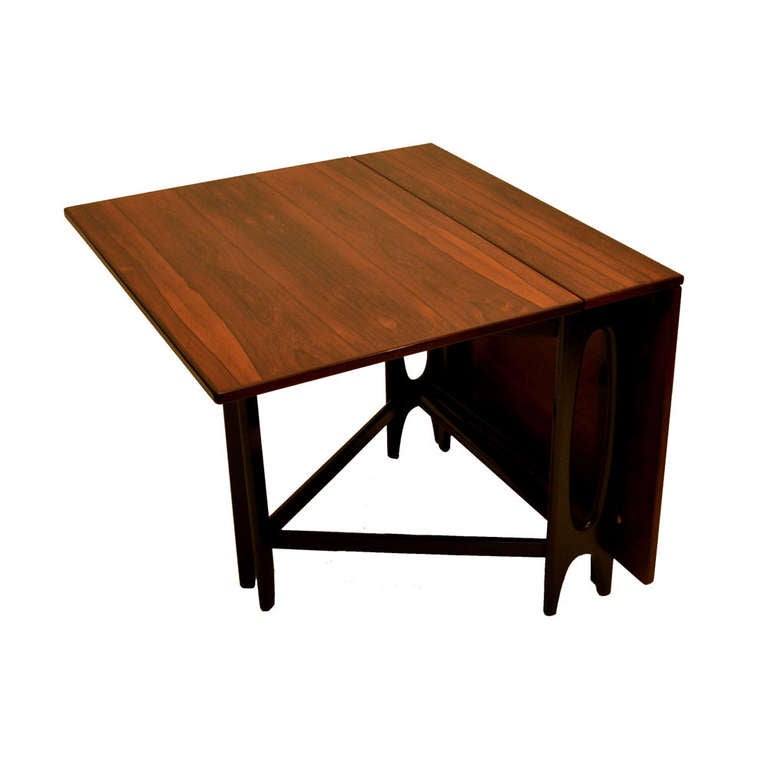 This flexible and compact table extends to 149 cm x 88 cm full length and can be reduced to an incredible 21 cm x 88 cm when the leafs of the tables drop by closing in ebonized wooden legs.

Dimensions when folded; Width 21, Depth 88 cm
Each drop