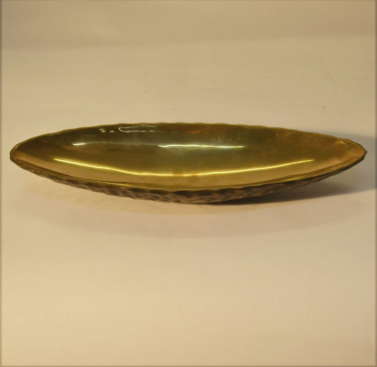 Bronze cast oval dish signed Svensk by the Danish jeweler WB with a textural patinated finish on the outside. 
Signed; Svensk WB