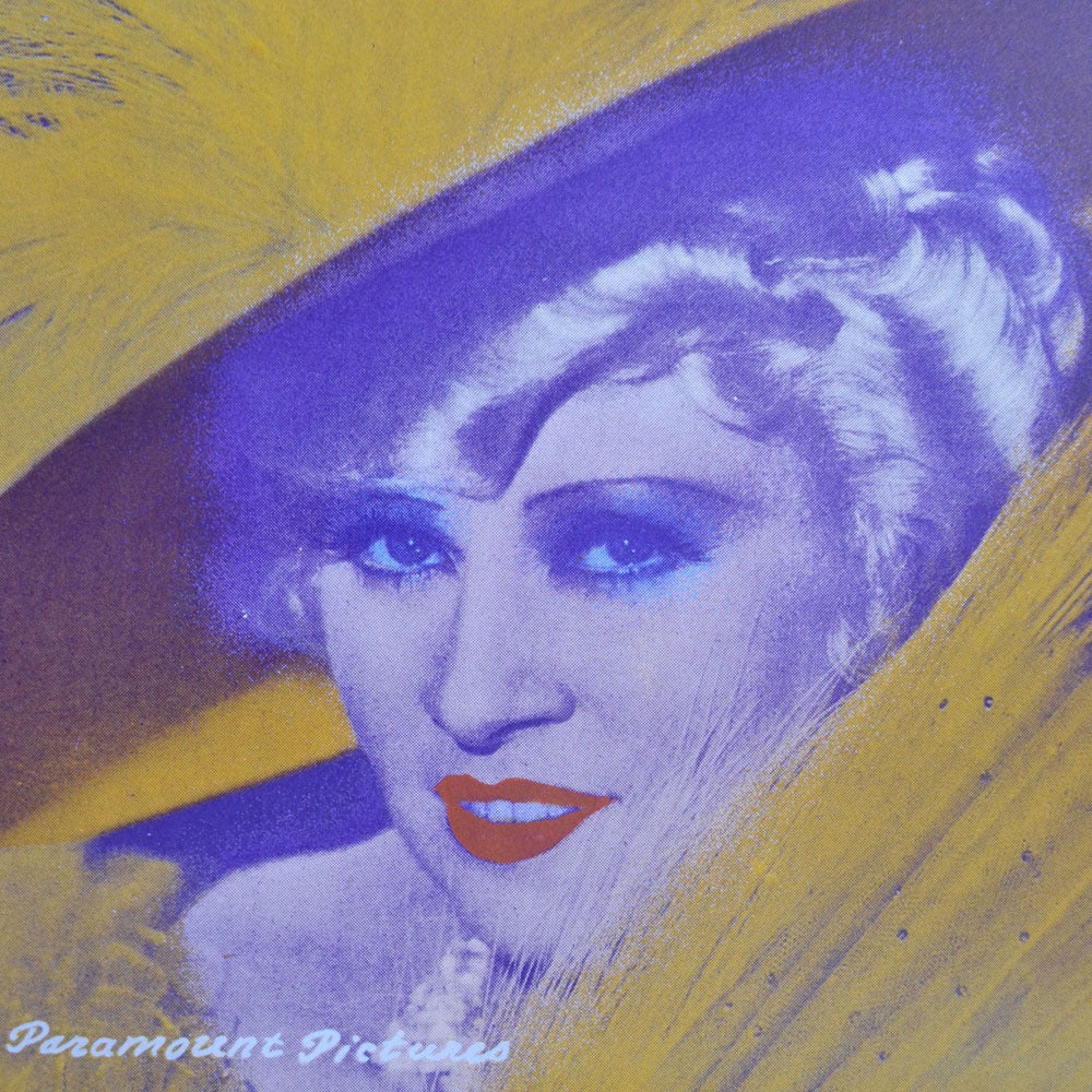Original limited edition screen-print 15/25 of Mae West in Pop Art style, framed in a white wooden frame.
