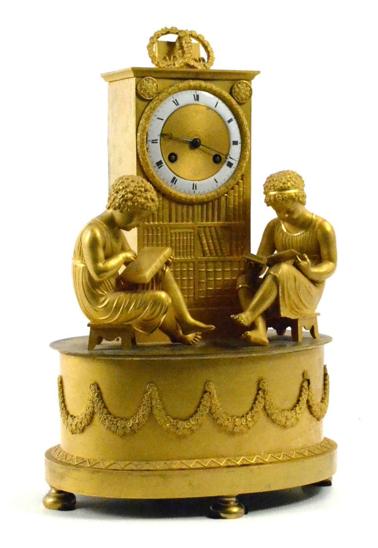 The two laurel crowns atop the clock, combined with the two children reading, can be interpreted as the exaltation of learning, especially instruction in the classical, liberal arts.