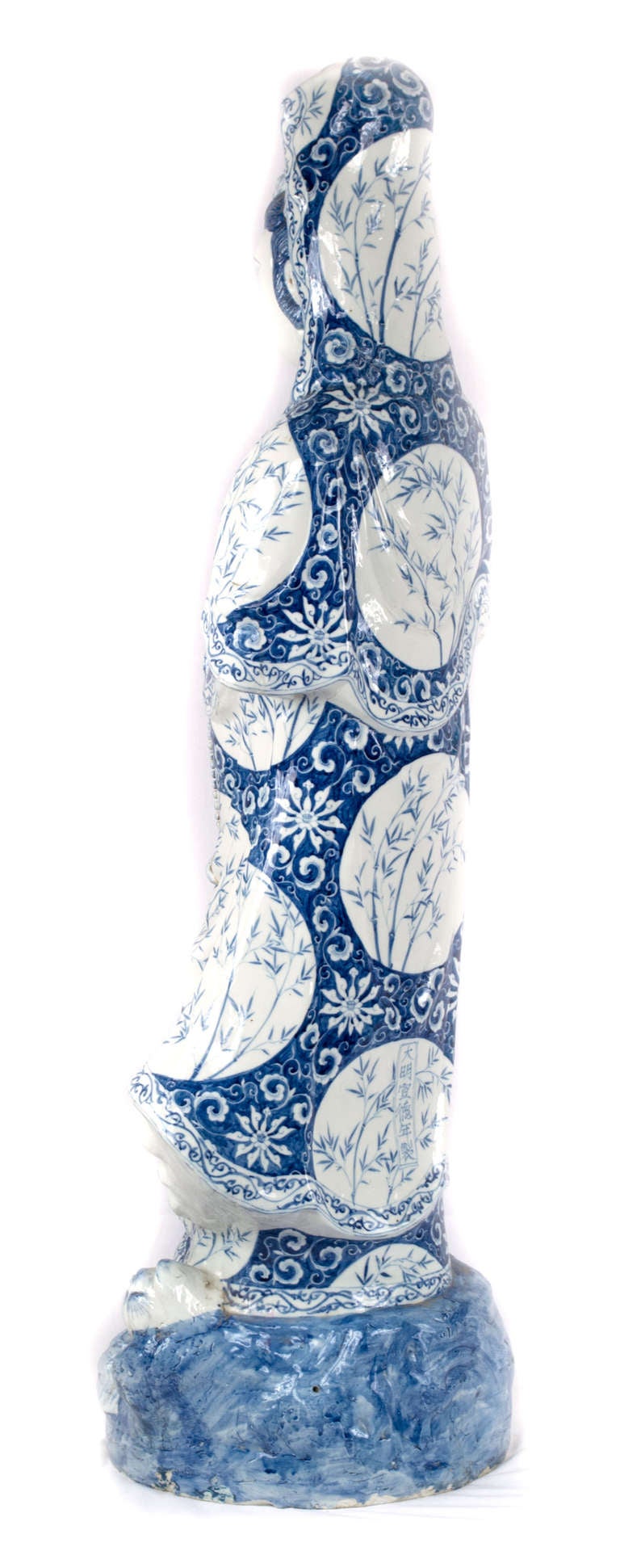 Venerated throughout Asia, Guan Yin (a.k.a. Guanyin, Kwanyin, Kwun Yam) is the personification of compassion. This blue-and-white, porcelain figure is in the style Guan Yin's from the Chinese region of Guangzhou.