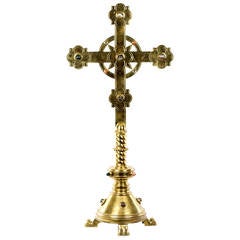An brass crucifix inlaid with precious stones