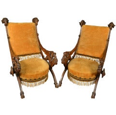 An Pair of Monumental Carved Walnut Lounge Chairs