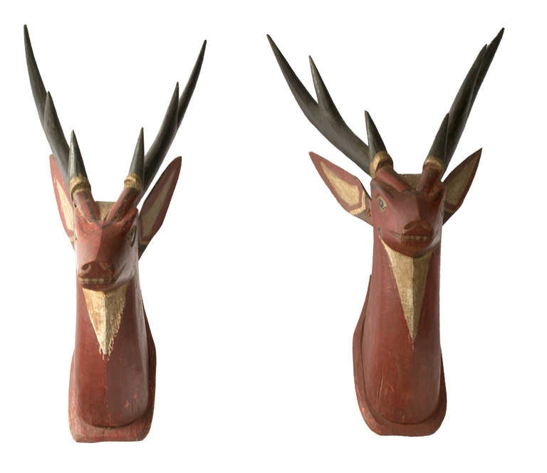 Two primitive mid-century, carved and painted wood Thompson's gazelle heads mounted as wall hanging.