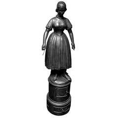 A monumental iron stove in the shape of a peasant girl