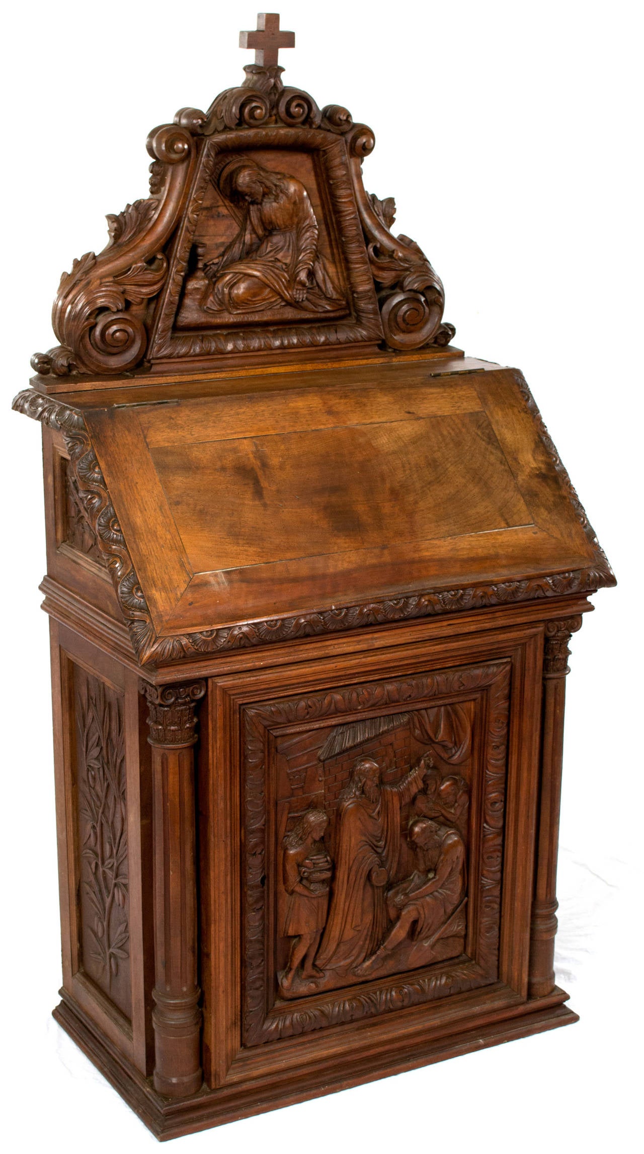 Beautifully carved with a scene of Christ praying in the Garden of Gethsemane (above) and a scene of Peter distributing bread to the hungry and poor, this French Walnut altar was made and used in a private home.