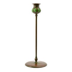 A Tiffany Bronze And Green Glass Candlestick