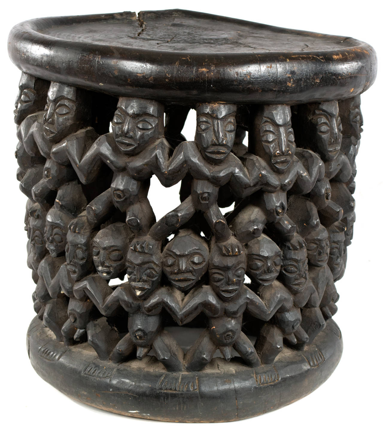 A nineteenth-century Bamileke carved wood throne chair with dozens of figures. Made in Bamileke (i.e. wester Cameroon) the throne chair was used by tribal chiefs or honored figures (Mkem) while presiding over official and religious services. The