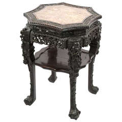 A rosewood Chinese captured-top carved marble table
