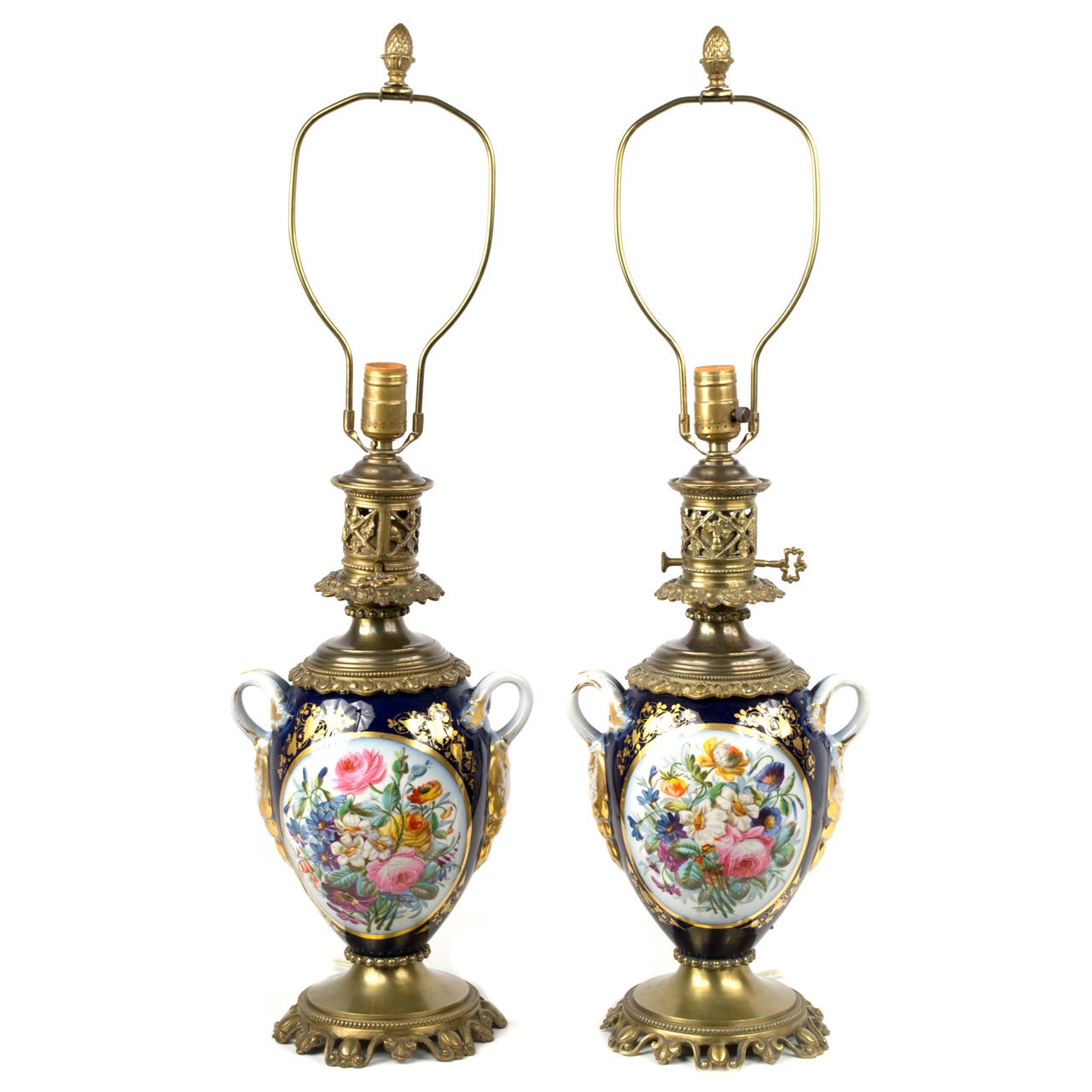 A Pair Of French Porcelain Lamped Vases With Ormolu Mounts