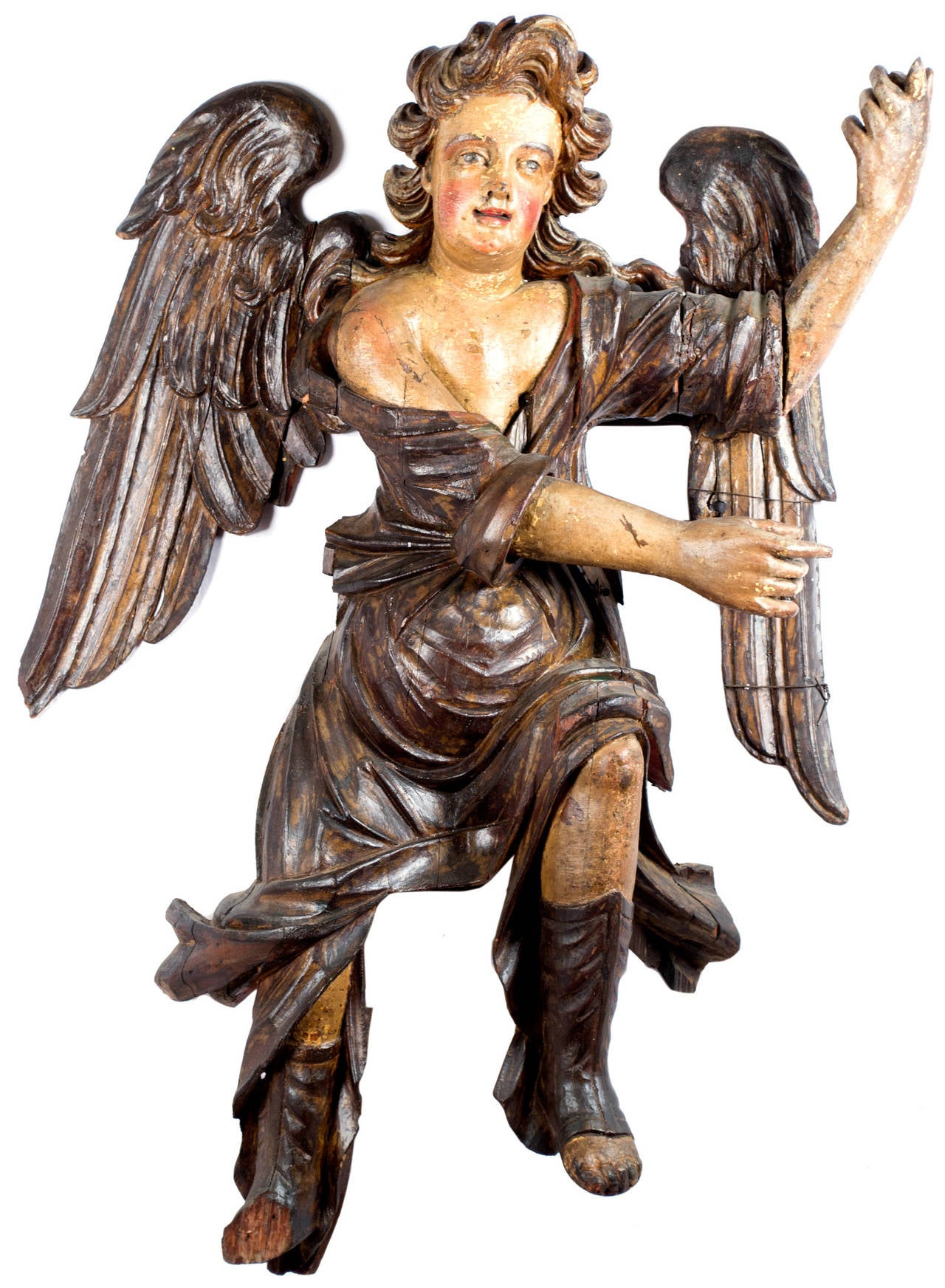 Meant to be mounted on a wall, each angel is almost life sized, beautifully carved, and meticulously painted. The statues were made in Northern Italy during the second or third quarter of the seventeenth century.