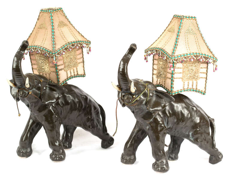 These fine Austrian bronze elephants have been lamped and fitted with elaborate silk and beaded shades.