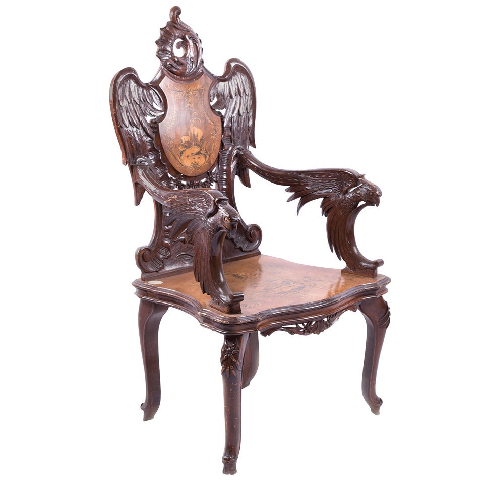 A Black Forest Carved Walnut and Fruitwood Armchair