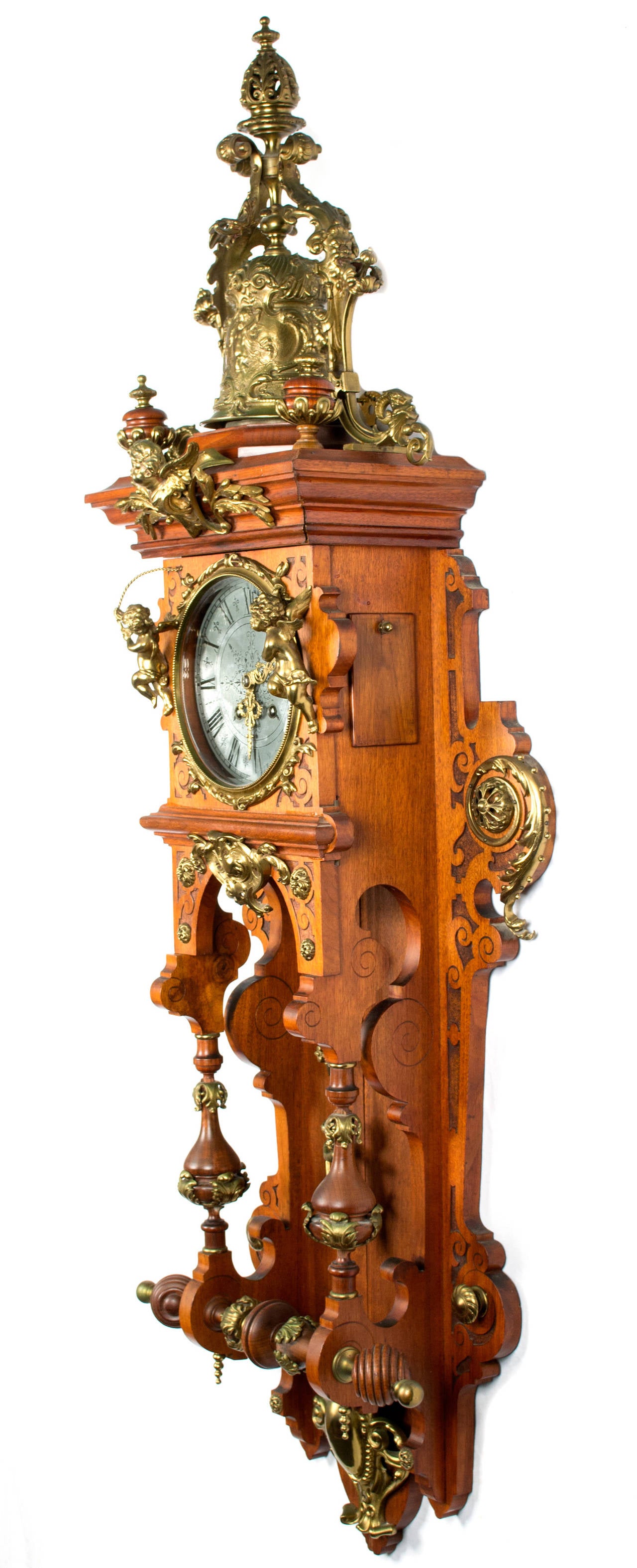 With a carved oak case intricate brass and pewter works, this German clock was made post-war in the Beaux-Arts style.