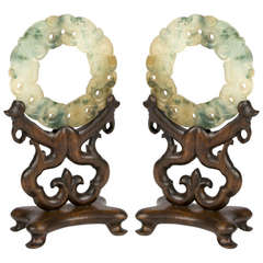 Pair of Carved Celadon and Russet Jade Discs on Stands